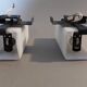 Pair of modernist sconces in black metal and white opaline vintage
