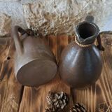 Dark brown stoneware jugs and pitchers with their cord