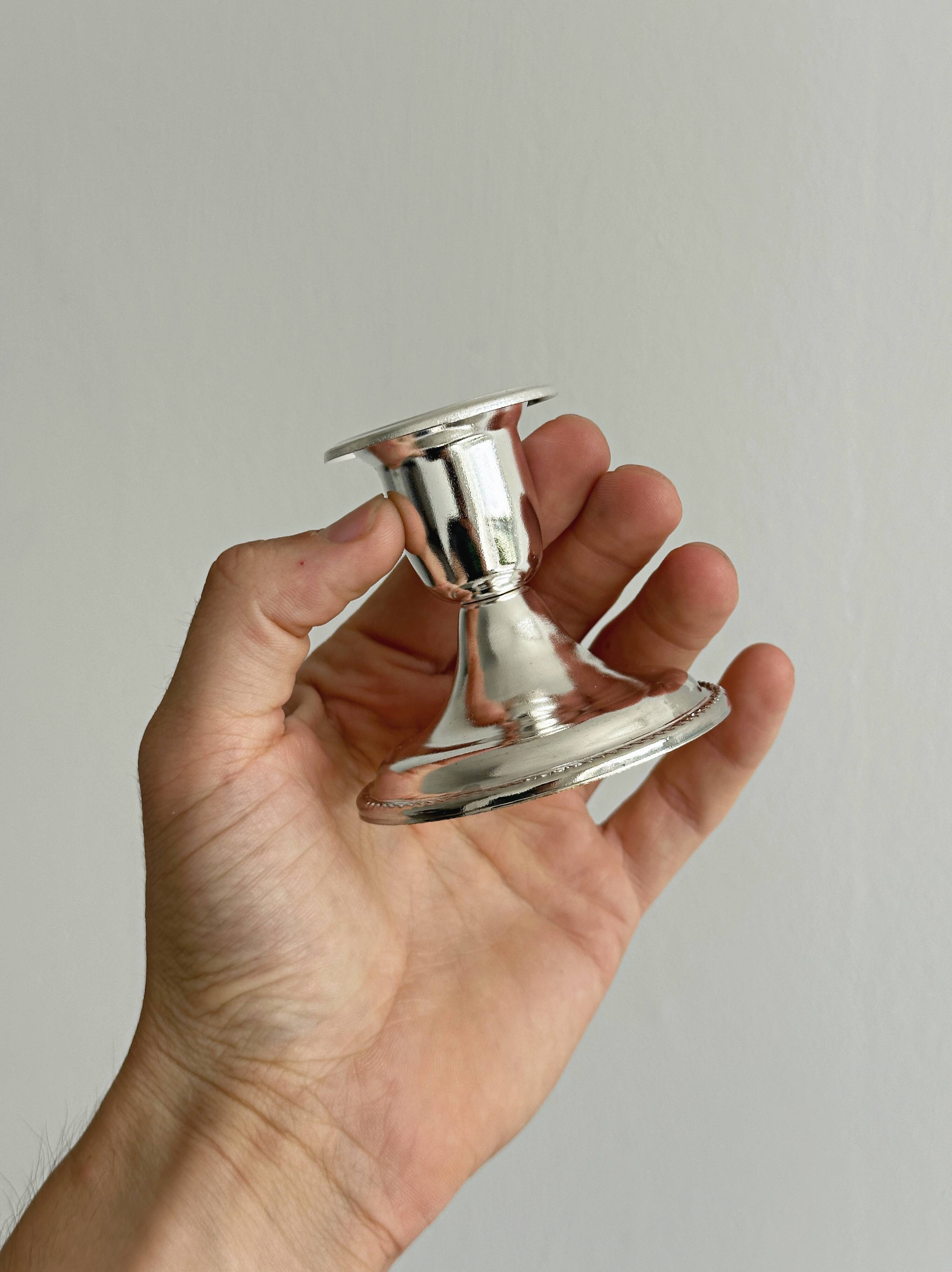 Pair of lightweight silver metal candlesticks