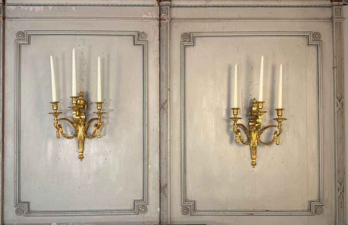 Pair of Louis XVI style wall sconces in gilded bronze, circa 1880.