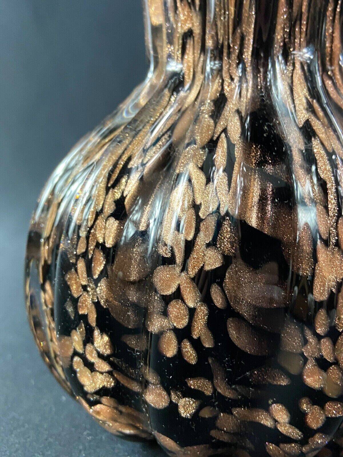 Vase signed in Murano Venice crystal with gold inclusion on a black background