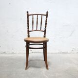 Chaise bistrot cannée ancienne en bois par les éditions Fischel