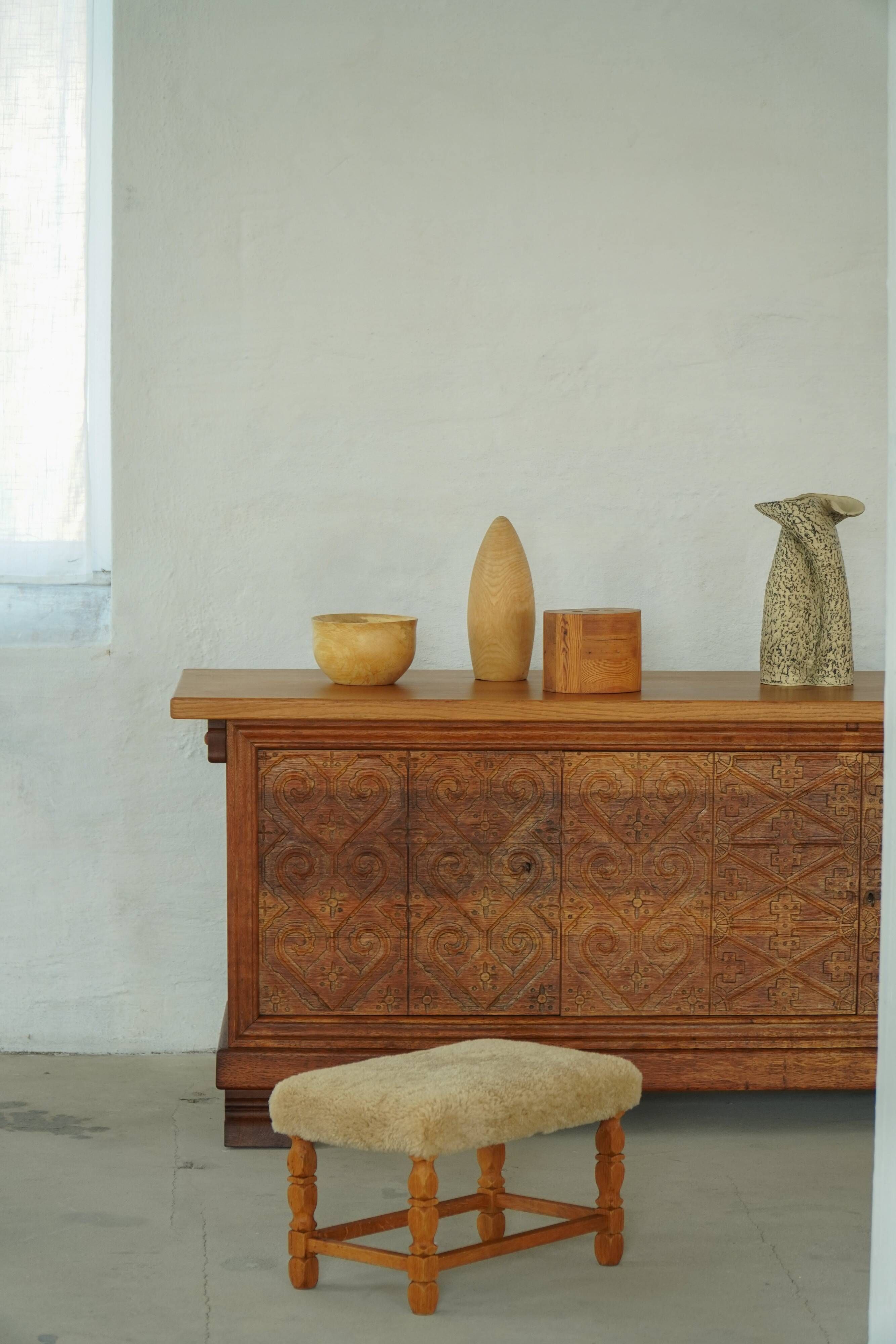 Rectangular oak stool, reupholstered in lambswool, Danish cabinetmaker, 1960.