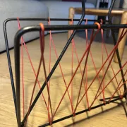 Vintage red and black scoubidou magazine rack, 1950s/60s