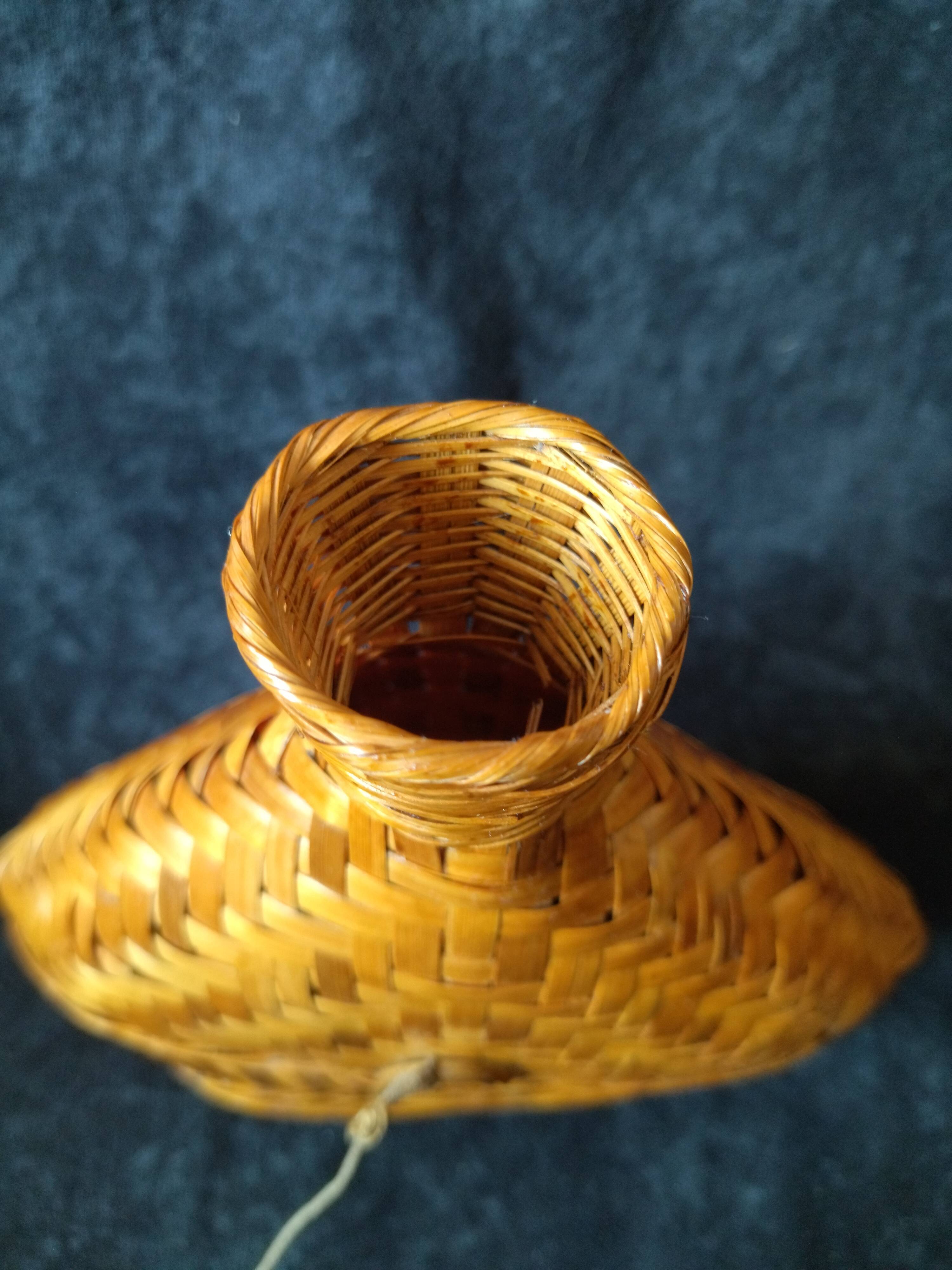 Vintage wicker and braided bamboo bottle