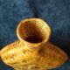 Vintage wicker and braided bamboo bottle
