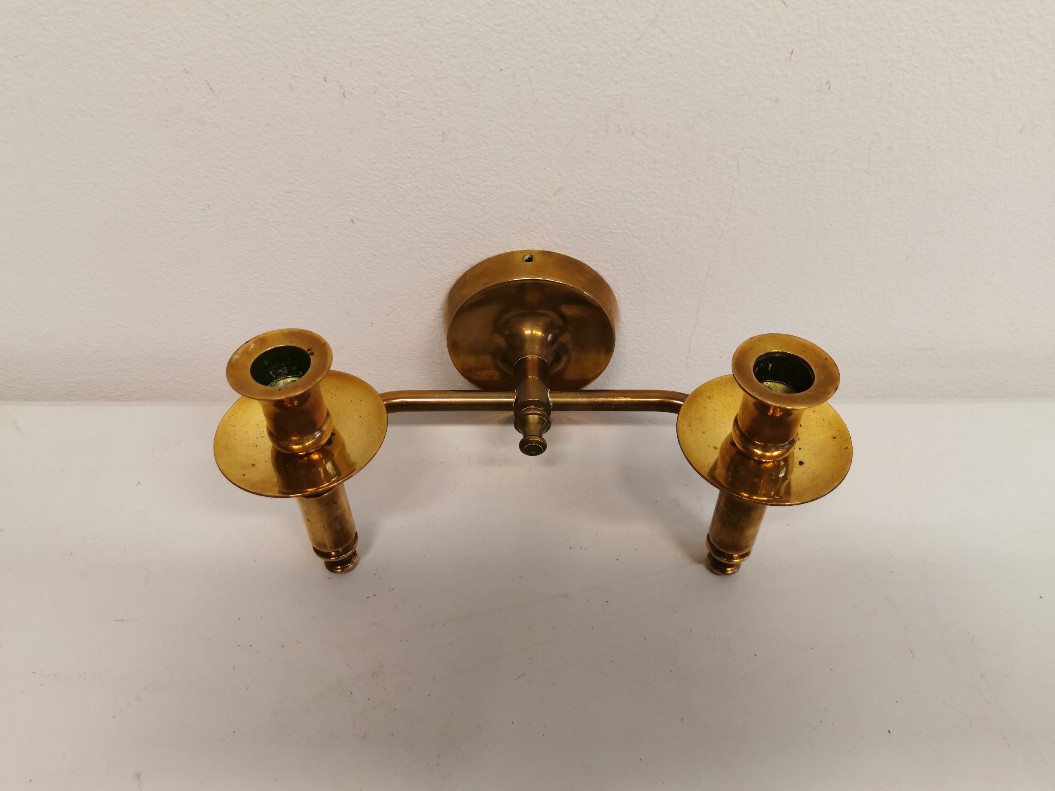 Classic Danish wall hung design candlestick in solid brass