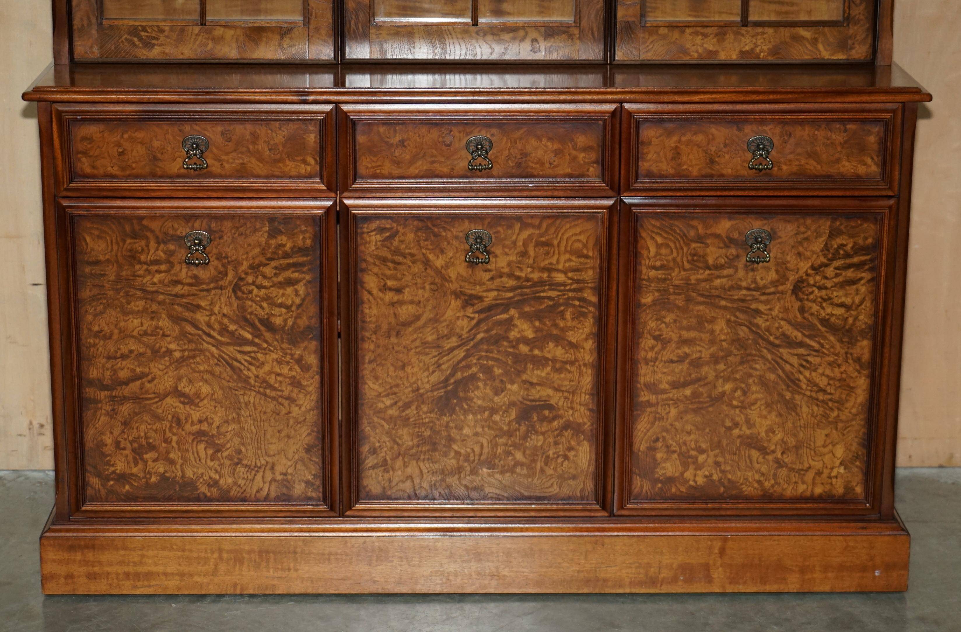 Vintage walnut burr buffet with glass and lighting, Art Deco style.