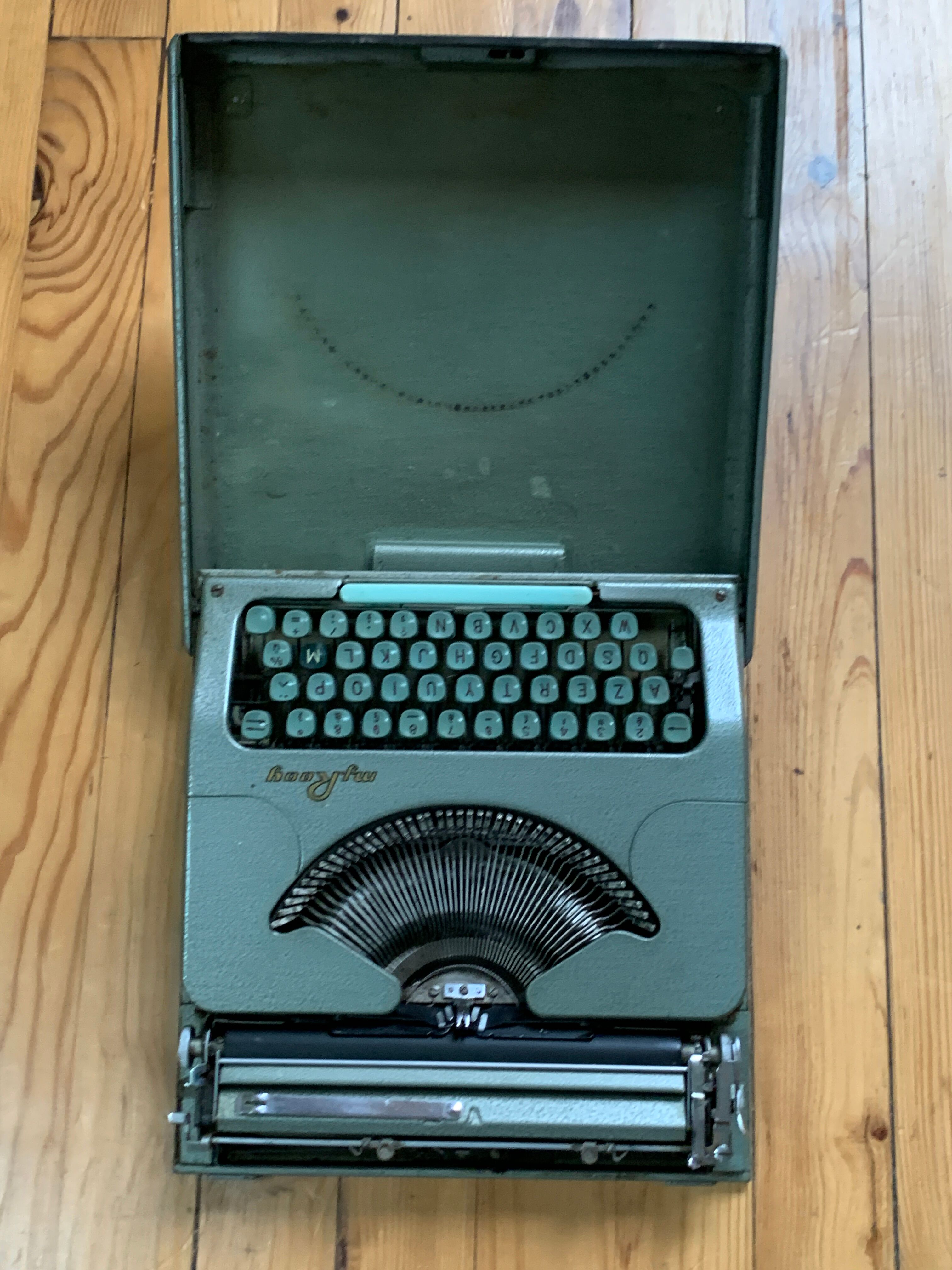 M.J. Rooy light green typewriter