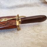 Vintage cutting service with knife and fork in wooden sheath