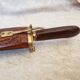 Vintage cutting service with knife and fork in wooden sheath