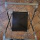 Tabouret pliant en acier et cuir