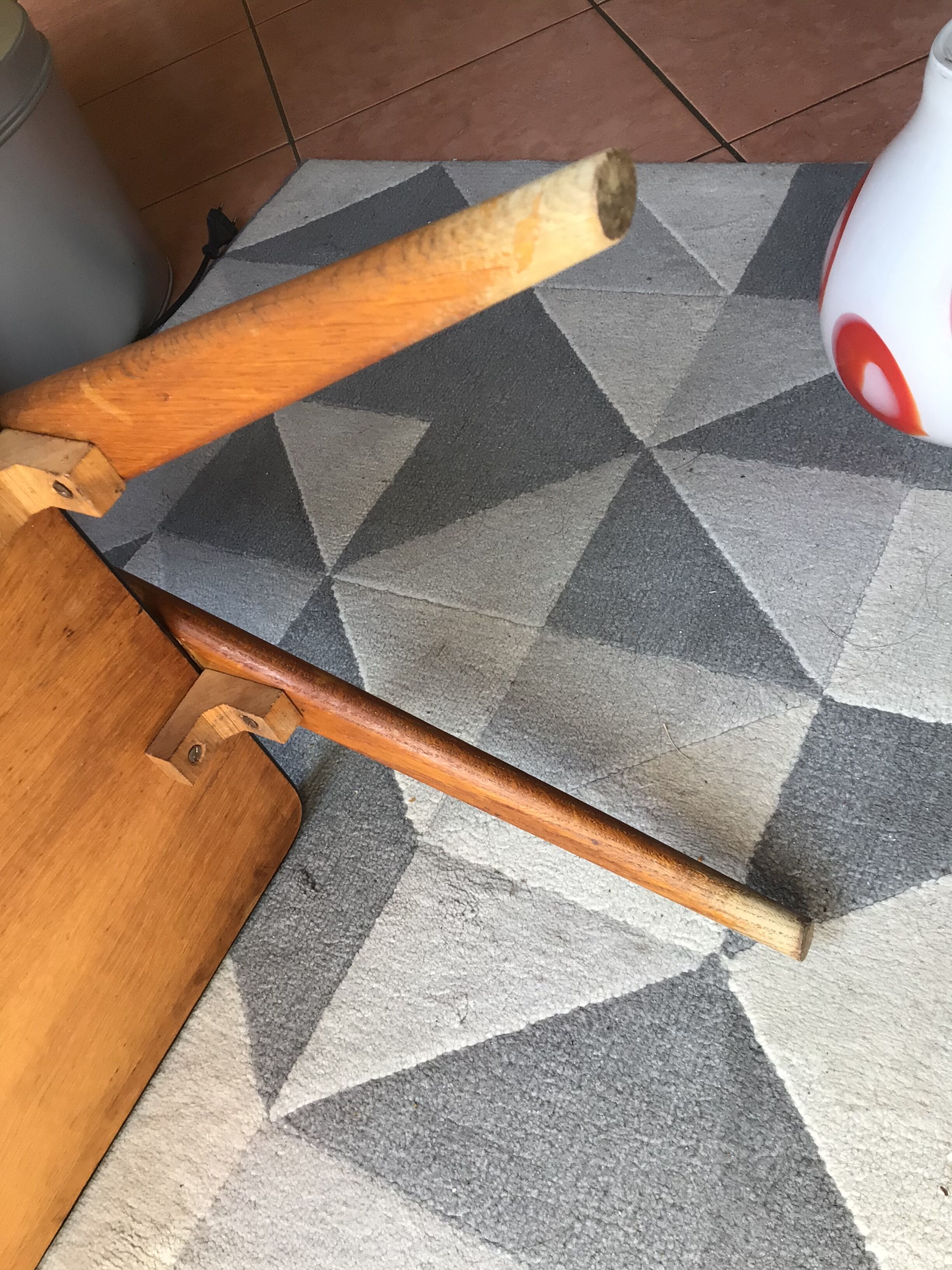 Double-footed red Formica wood spindles console