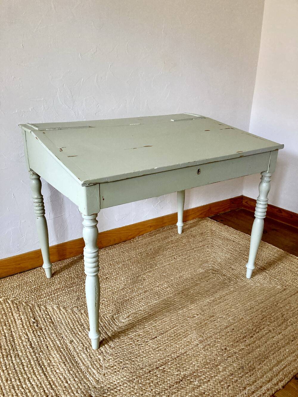 Antique wooden sloped desk, with a drop-down front and turned legs.