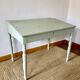 Antique wooden sloped desk, with a drop-down front and turned legs.