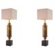 Pair of patinated brass table lamps, granite base, artistic design