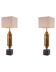 Pair of patinated brass table lamps, granite base, artistic design