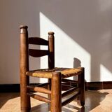 Low fireplace chair attributed to Charles Dudouyt.