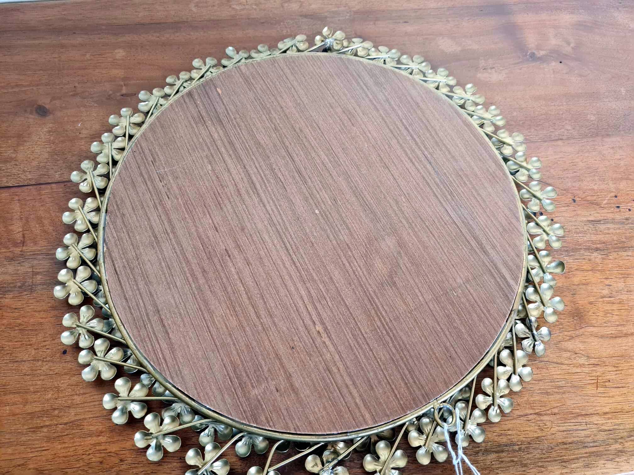 Vintage round mirror in gold metal circa 1950