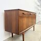 Teak Jentique sideboard — 1 door, 2 drawers & drop-down bar, England 1950s-60s