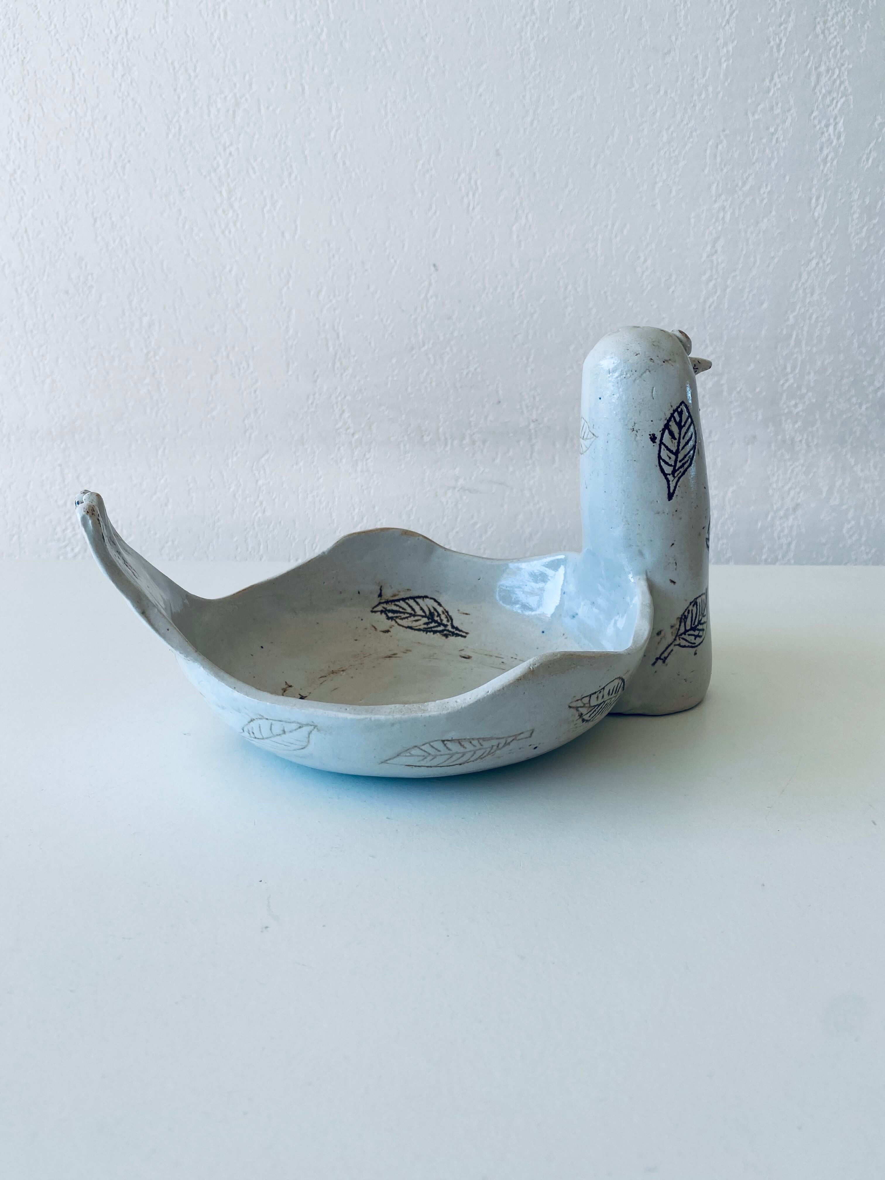 Large empty pocket or cup made of bird ceramic