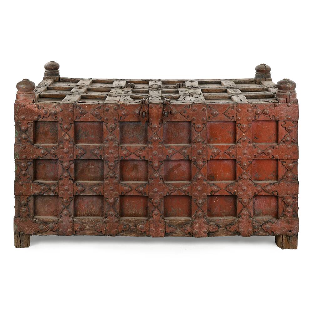 Large wooden and metal chest with red patina