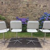 Vintage swivel chairs with chrome tubular base and silver skaï brand unic desing.