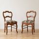 Pair of antique Louis XV style chairs in wood and floral fabric.