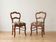Pair of antique Louis XV style chairs in wood and floral fabric.