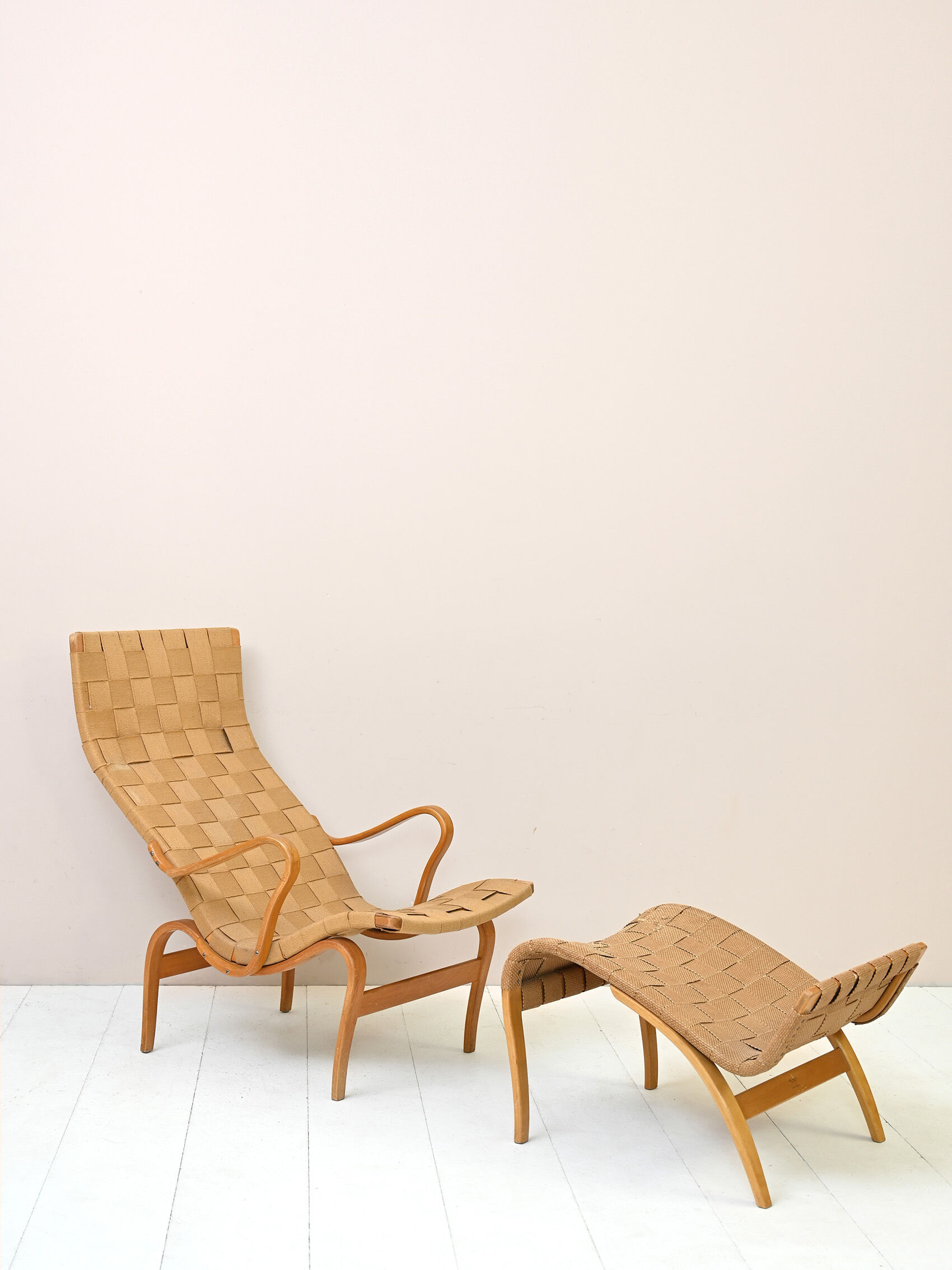 'Pernilla' armchair and footstool designed by Bruno Mathsson