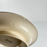 Presentation plate with pedestal Longwy, early 20th century, floral decoration.