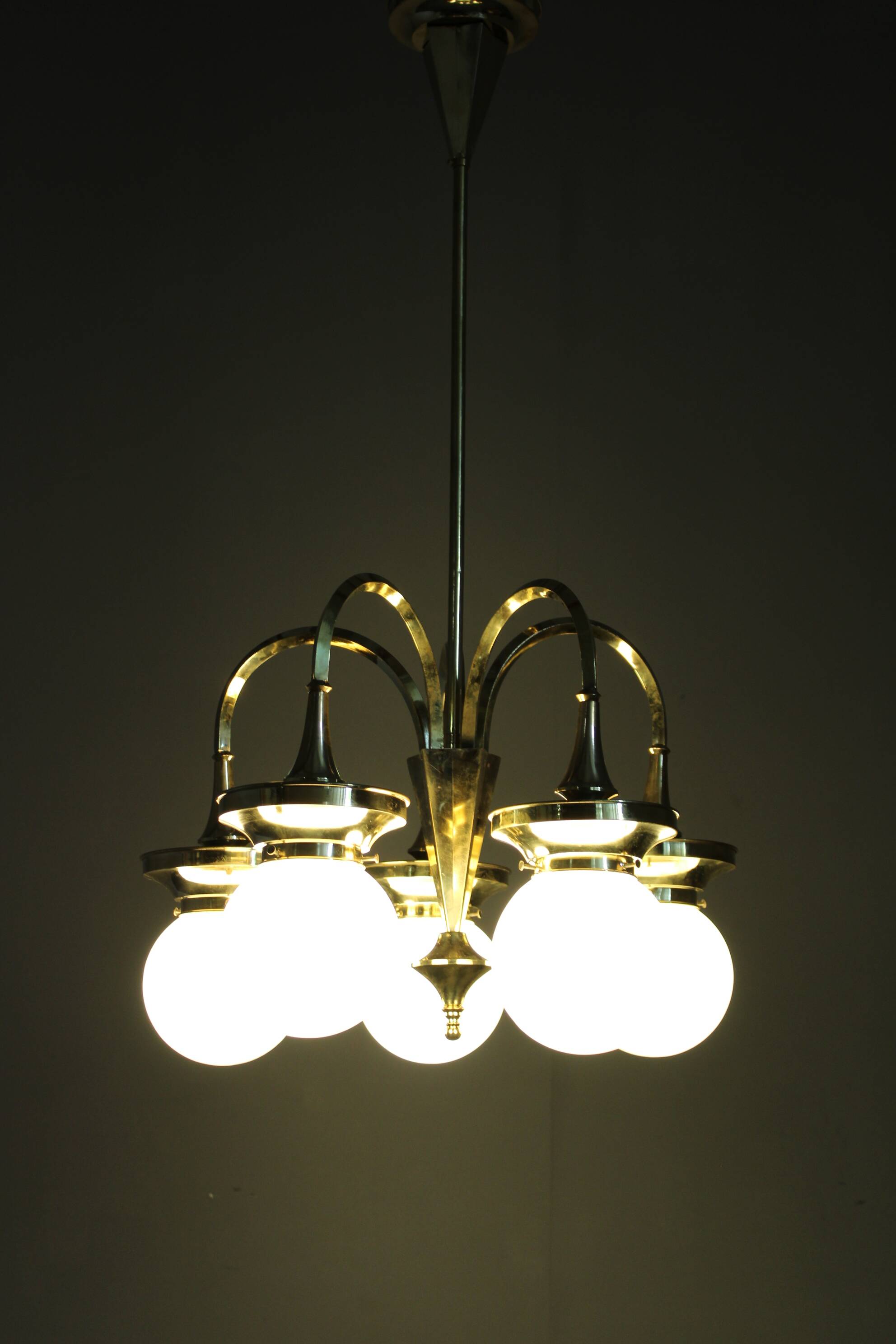 1930s Czechoslovak Art Deco brass chandelier with five opaline glass globes
