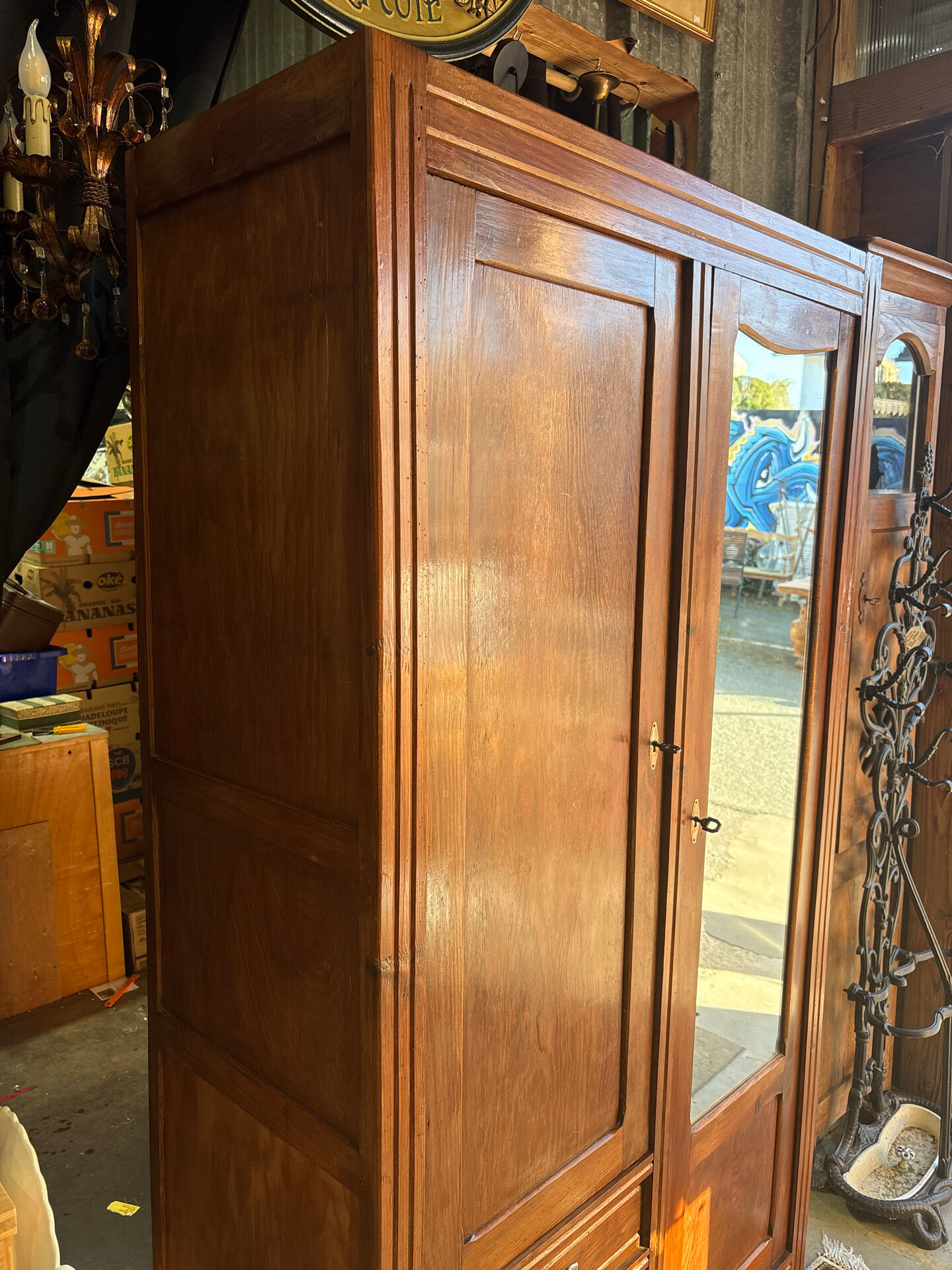 Antique Parisian wardrobe with mirror, hanging space and drawers.