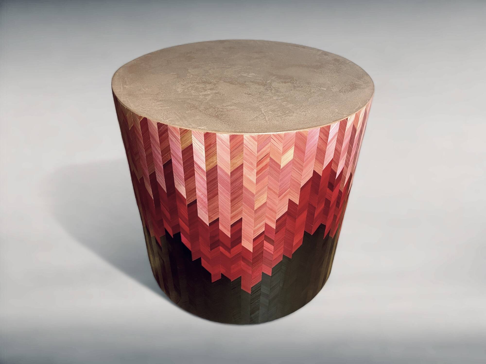 Side table with straw/inlaid concrete.
