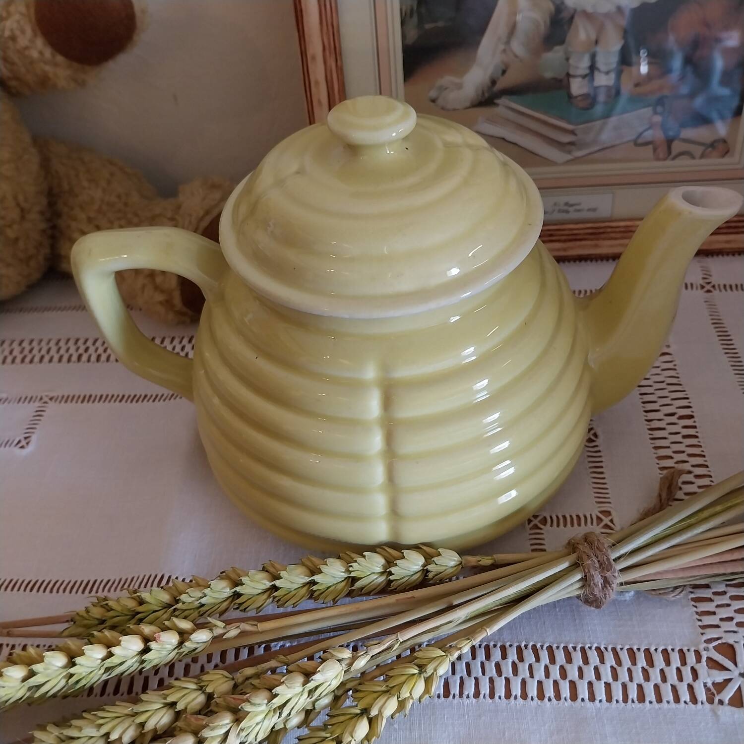 Old yellow earthenware teapot
