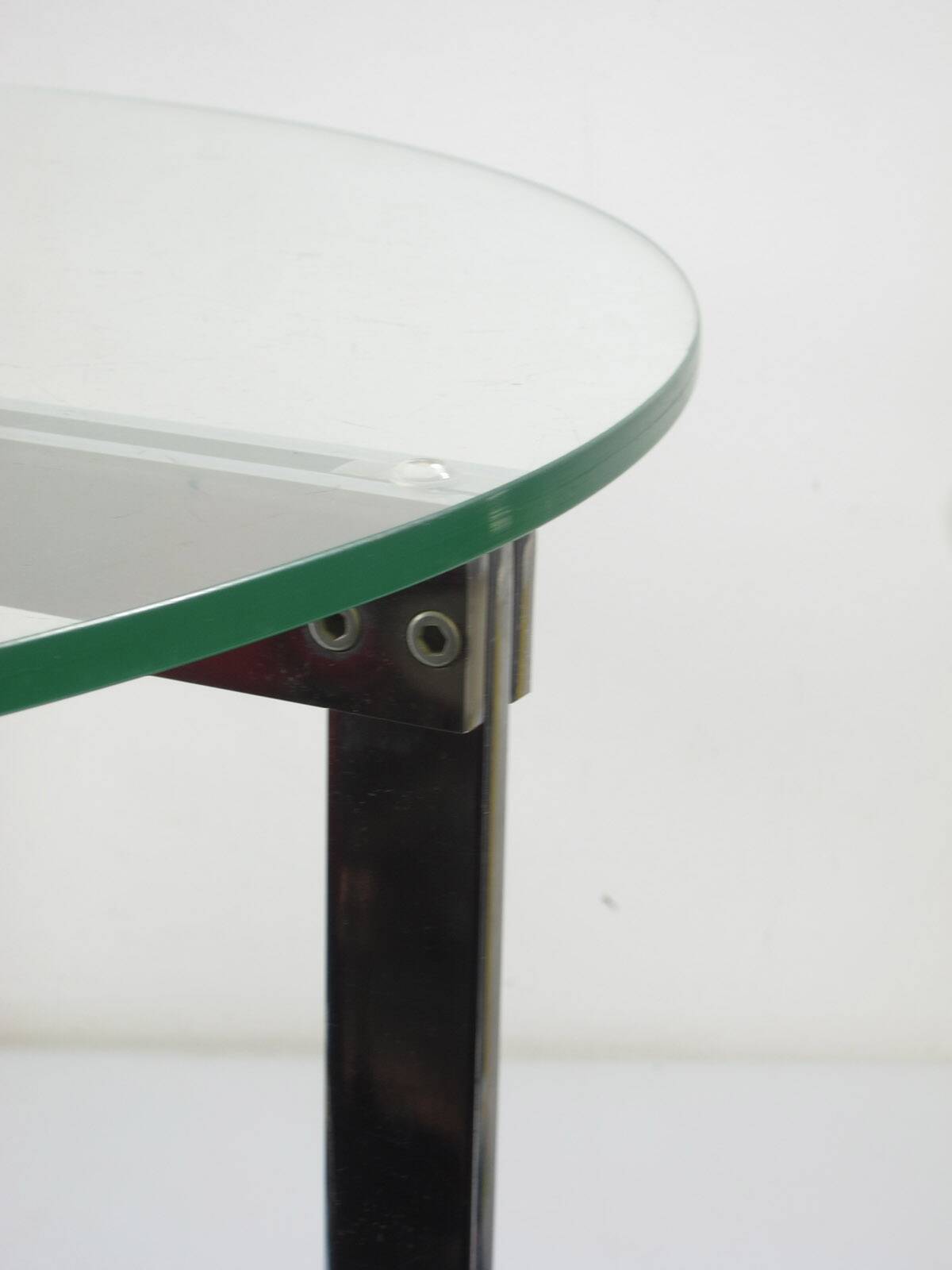 Modernist glass coffee table with stainless steel base