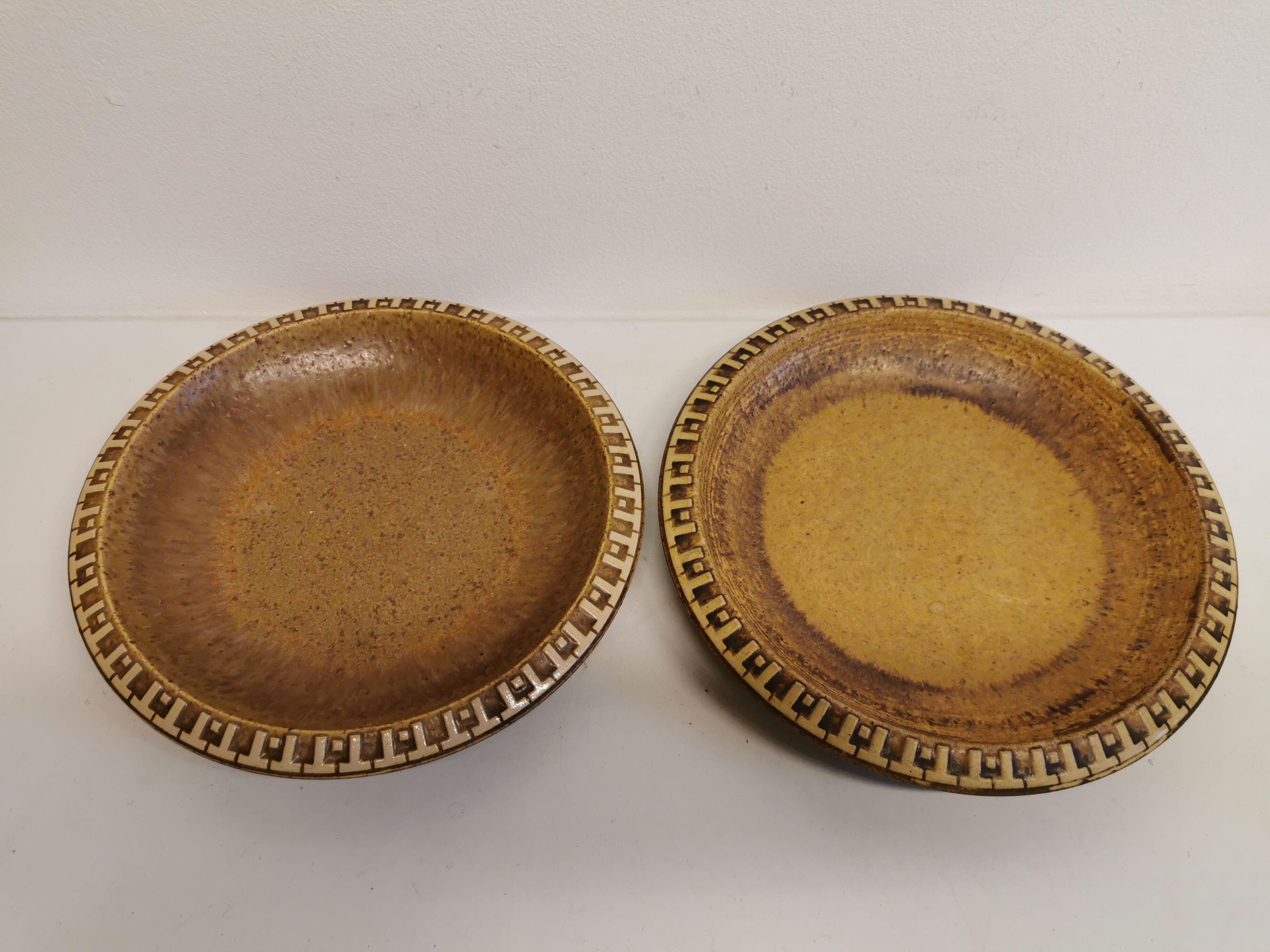 Ceramic plates, designed and made by Danish Ravnild (both stamped and signed)