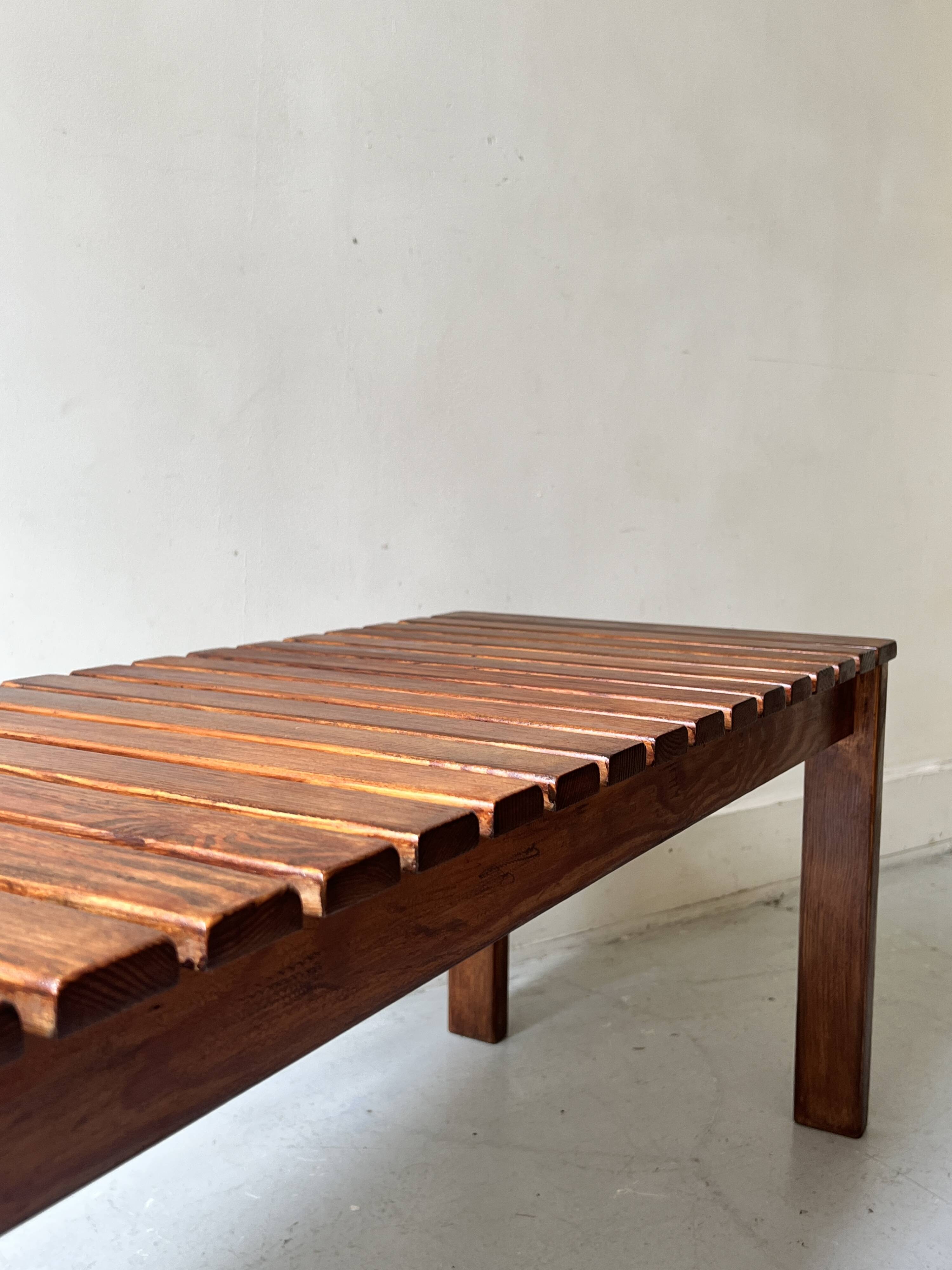 Bench / modernist coffee table made of wooden slats, 1970s design.