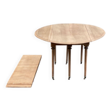 Renovated Louis Philippe round extendable dining table with leaves from the 18th century.