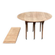 Renovated Louis Philippe round extendable dining table with leaves from the 18th century.