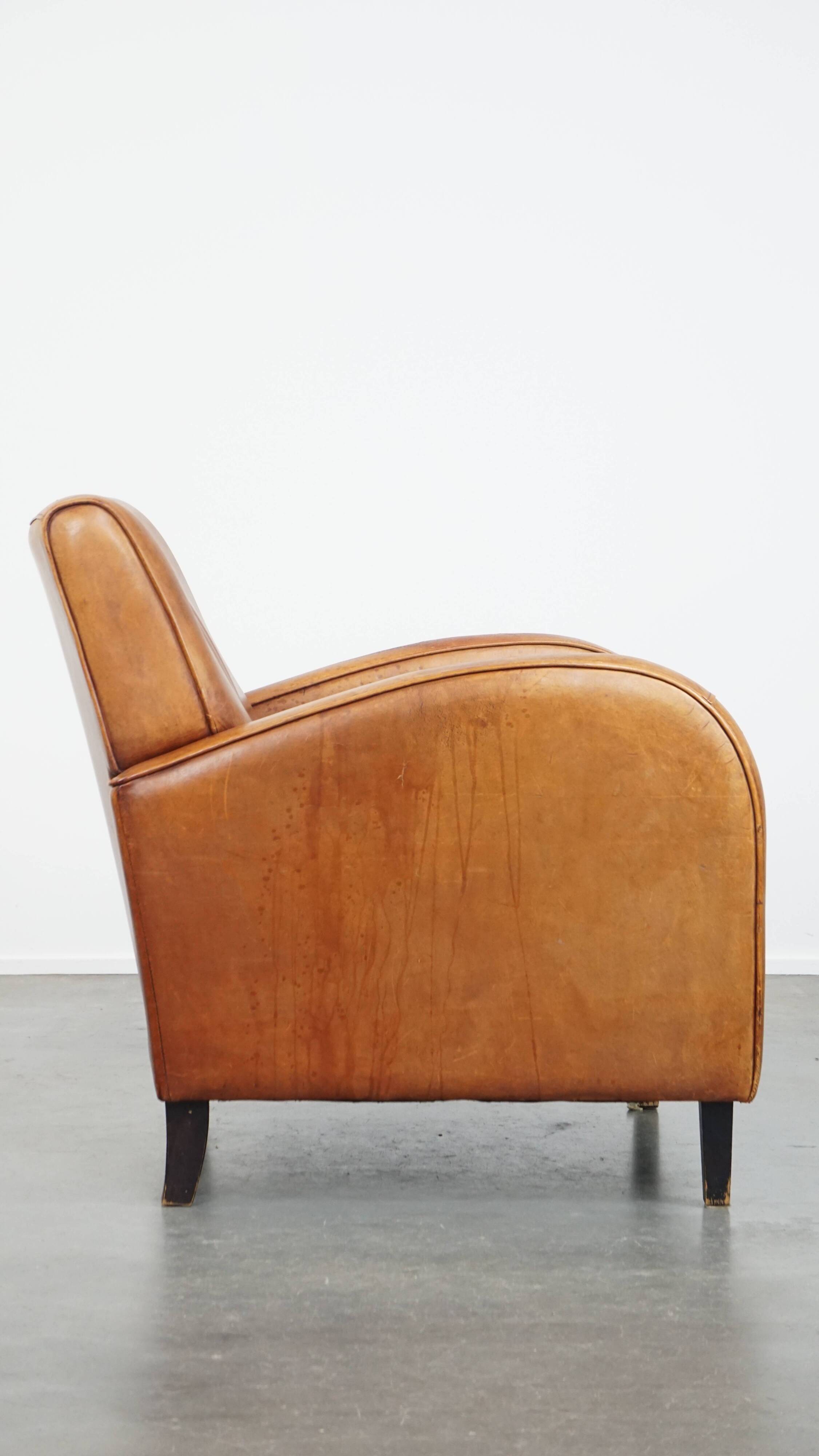 Characteristic sheepskin design armchair in beautiful warm cognac colours