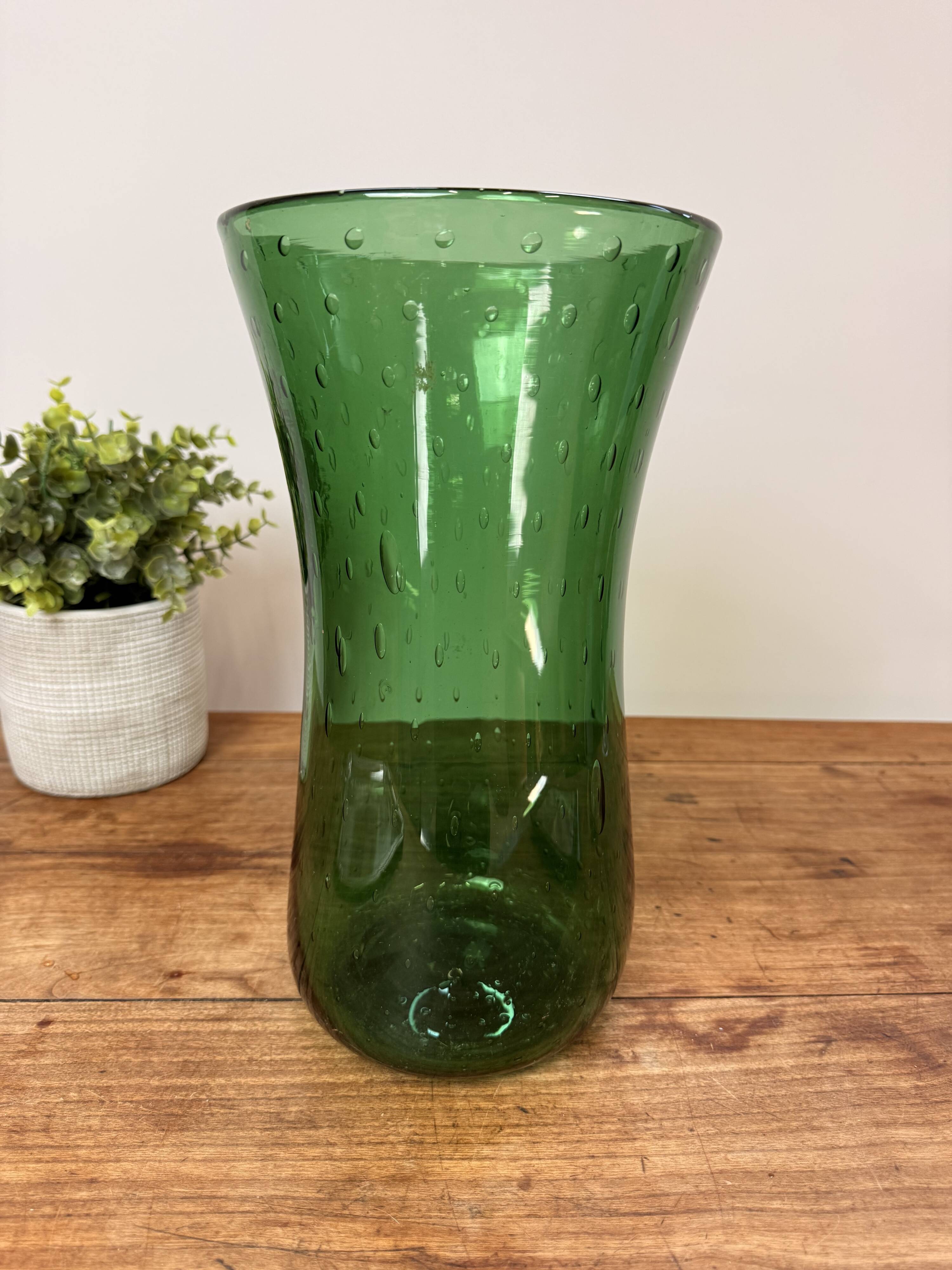 Green blown glass vase with a bubble design