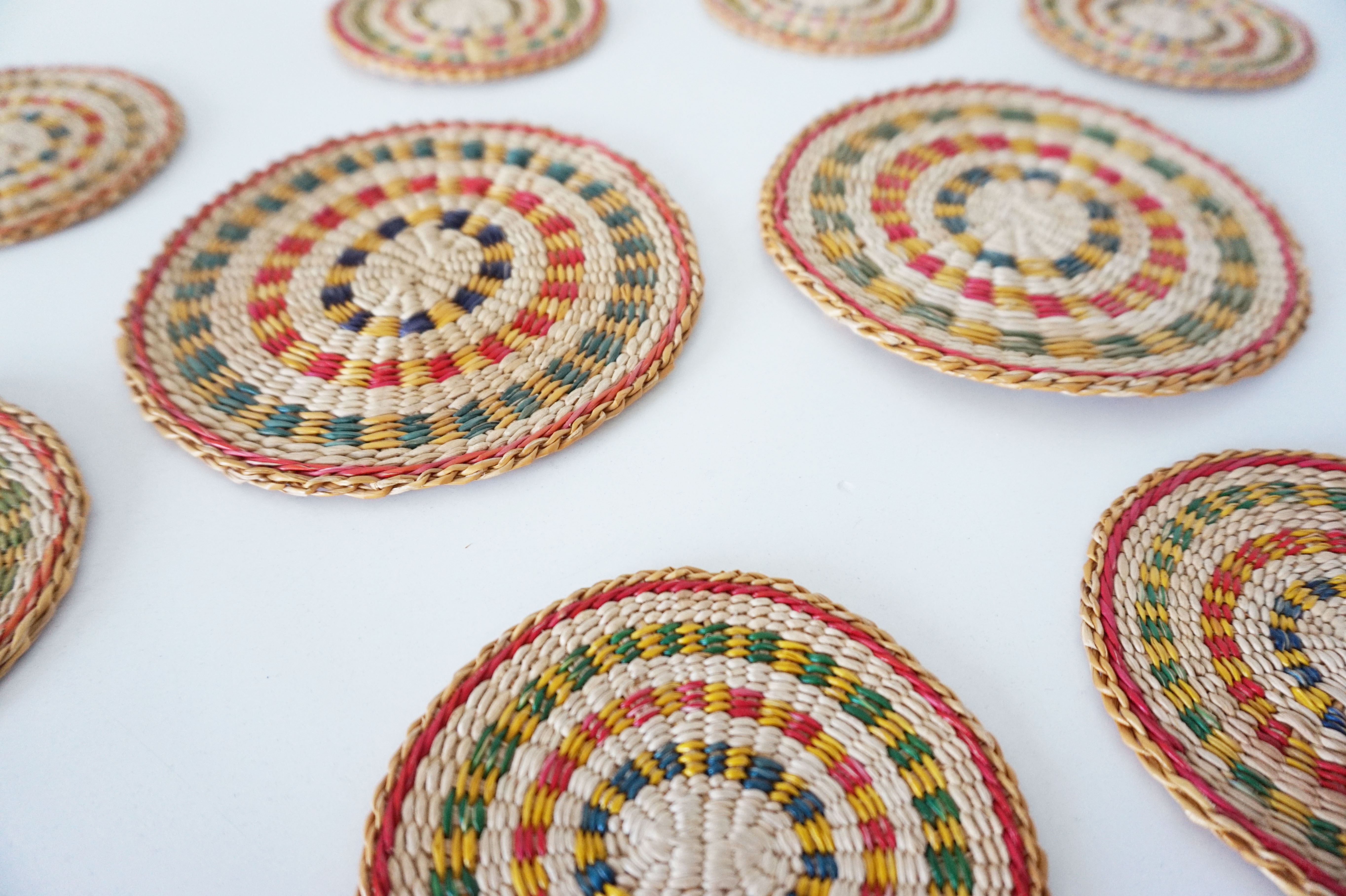 Set of coasters and bottles in colored wicker