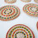 Set of coasters and bottles in colored wicker