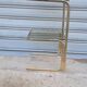 End table in gold metal and smoked glass