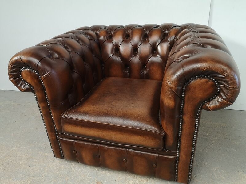 Brown leather chesterfield armchair