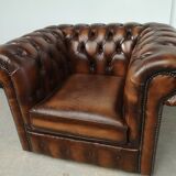 Brown leather chesterfield armchair