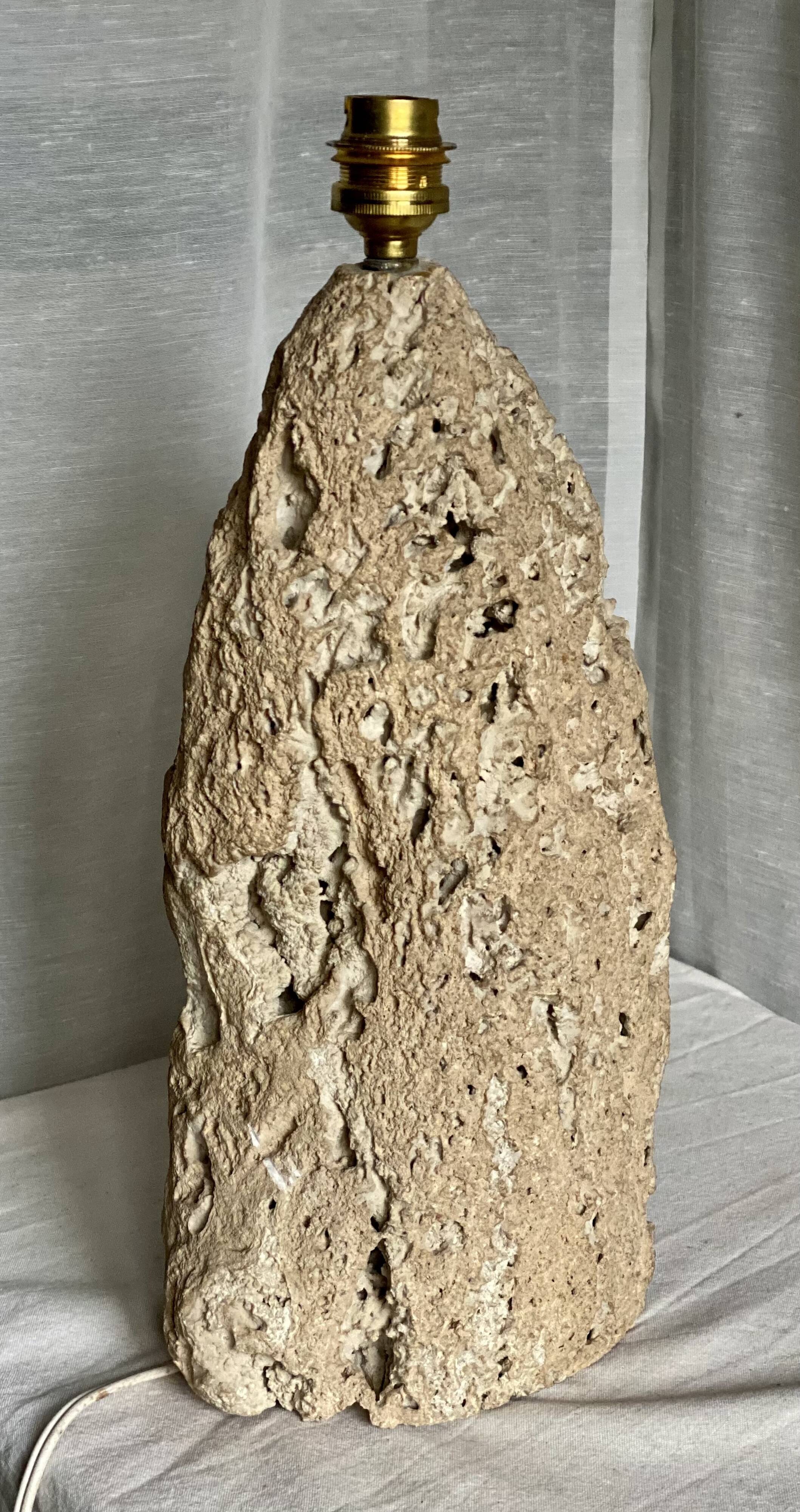 Brutalist vintage stone lamp from the 1970s, raw art.