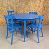 round table with 4 chairs and 2 extensions