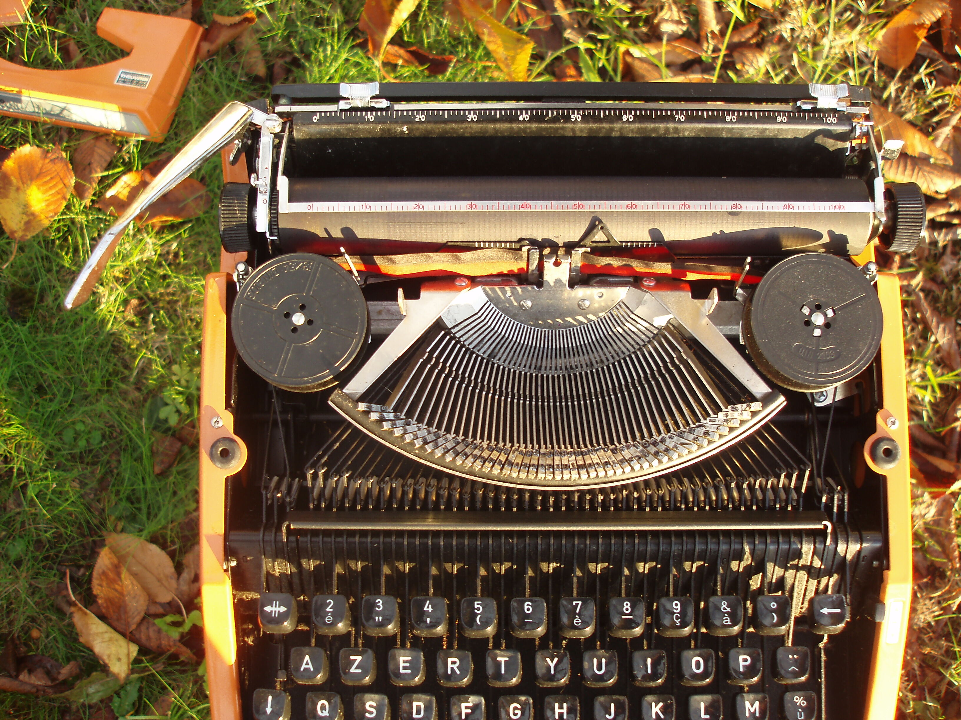 Silver reed orange and black typewriter with bag